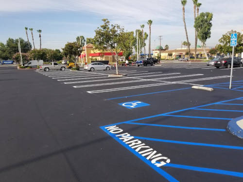 Parking lot with new ADA striping in place